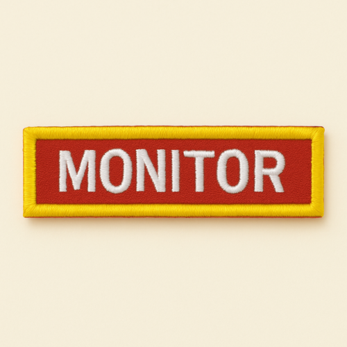Insignia de cargo Monitor